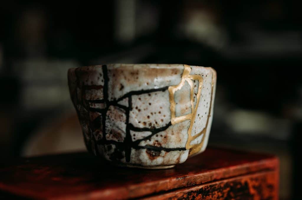 white and blue floral ceramic cup